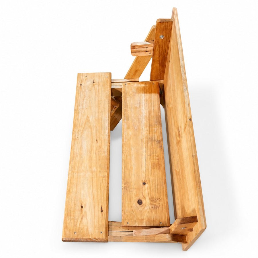 Mesa plegable Praktico en modo banca, de canto